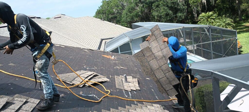 Wescon employees replacing roof of client