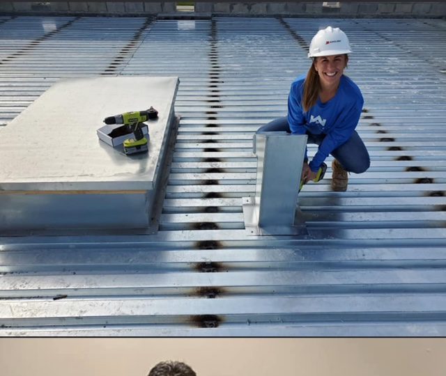 Female Roofer Working on a roof 