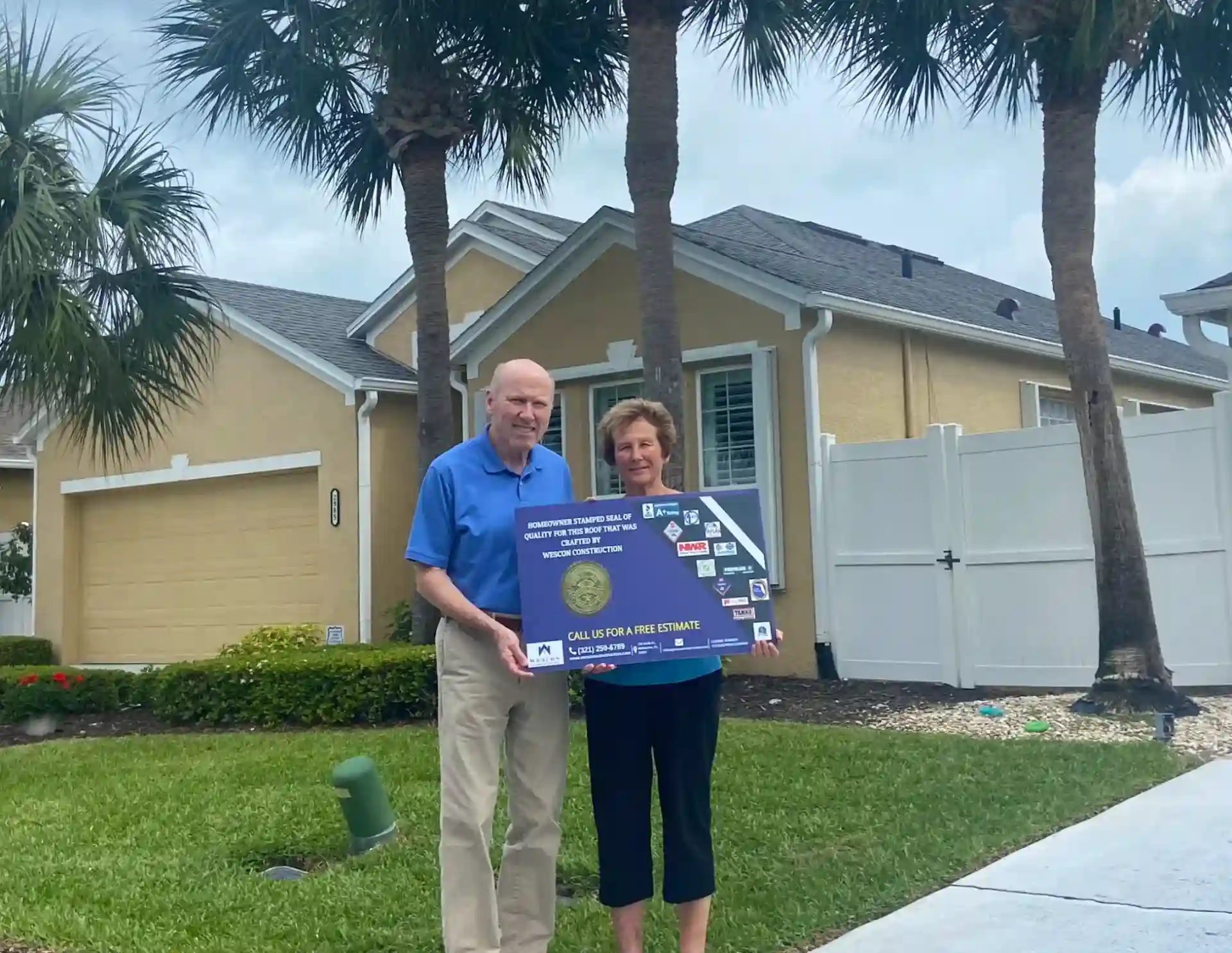 happy customers with a new shingle roof